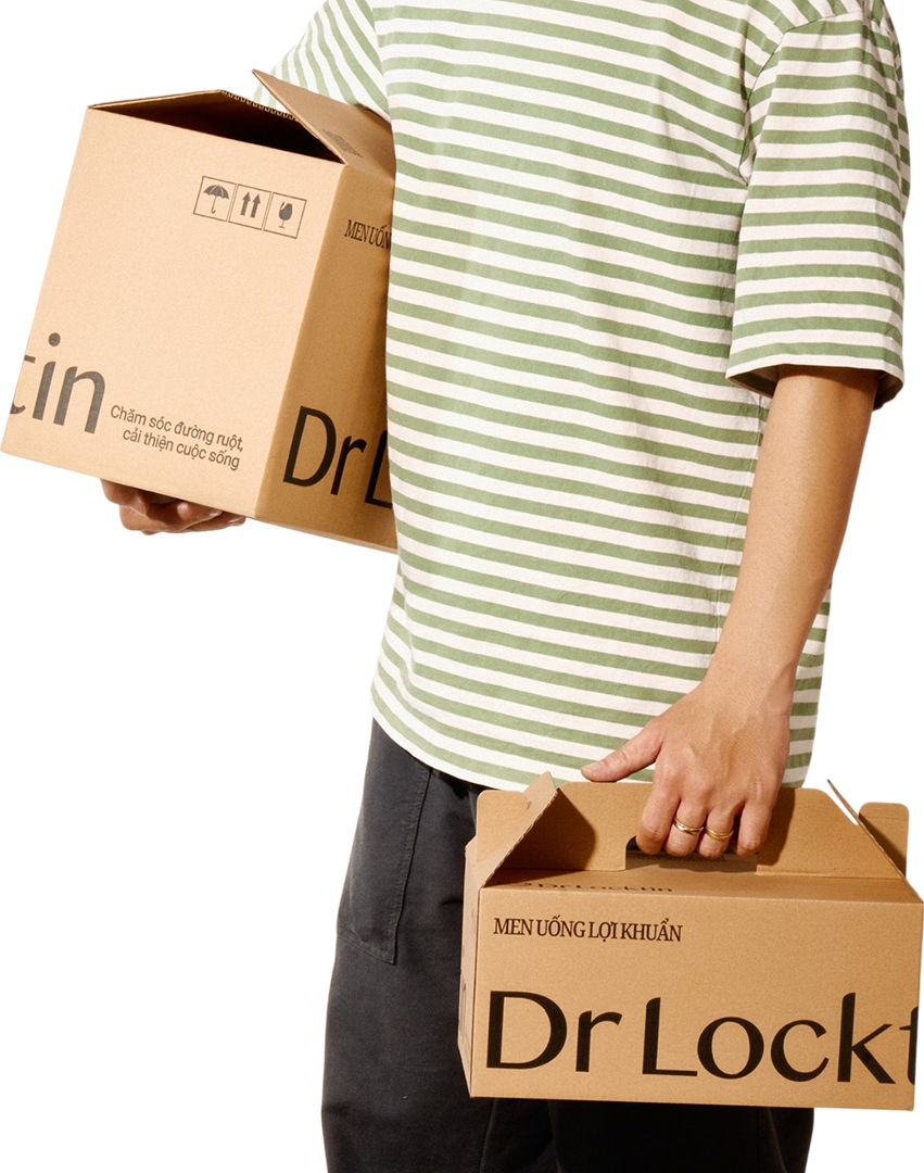 Woman wearing straw hat with sunlight creating dappled shadows on face